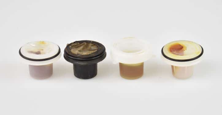 Examples of grease caps from several different encapsulated anchor systems