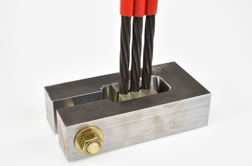 Patent Pending Flat Wedge Lock-Off provides versatile anchor design to secure multiple cables